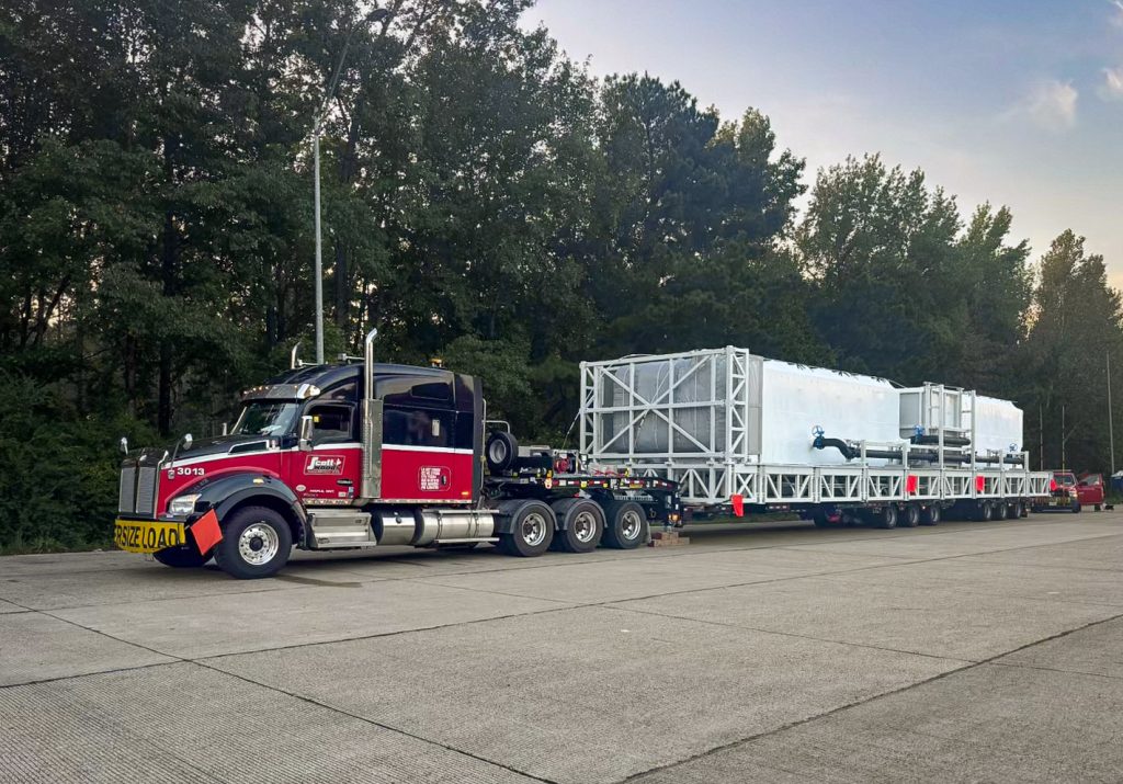 Scott-Woods heavy haul fleet transporting oversized industrial equipment using specialized multi-axle trailer systems.