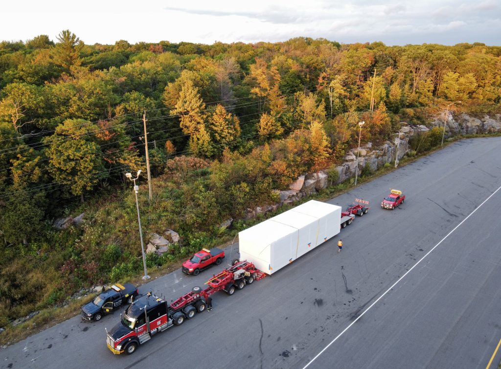 Scott-Woods transporting oversized modular freight using advanced heavy haul trailer configurations and escort vehicles.